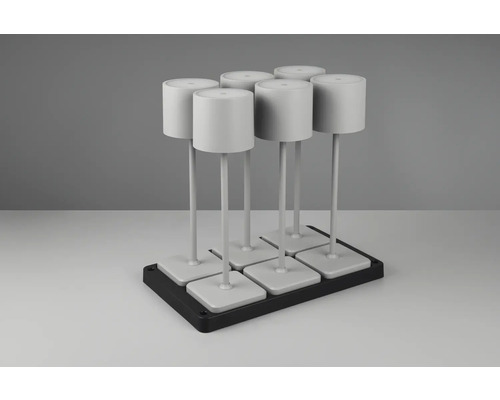 Six lampes blanches sur une base noire.