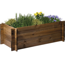 Hochbeet aus Holz mit verschiedenen Kräutern und Blumen bepflanzt