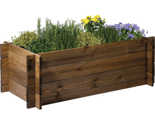 Hochbeet aus Holz mit verschiedenen Kräutern und Blumen bepflanzt