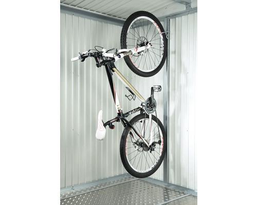 Vélo sur un support à vélos dans un garage