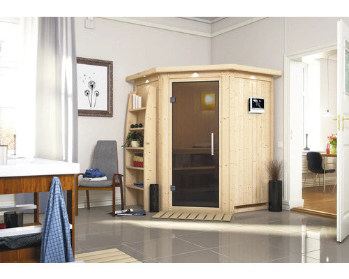 Sauna modulaire Karibu Callinan avec poêle 9 kW et commande ext., avec couronne et portes entièrement vitrées couleur graphite Sauna en bois avec porte en verre dans une salle de bain lumineuse.