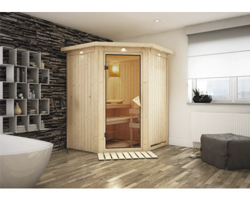 Sauna modulaire Calienta Callinian y compris poêle bio 9 kW avec commande externe et couronne Sauna d'angle en bois avec porte en verre dans une salle de bain avec baignoire, étagère et fenêtre.
