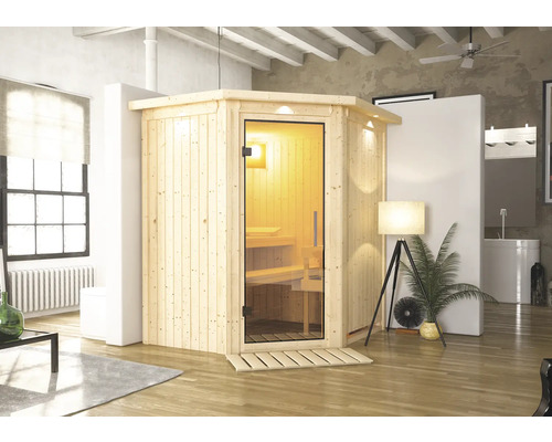 Sauna en bois avec porte en verre et éclairage intérieur dans une pièce lumineuse