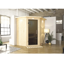 Sauna en bois avec porte en verre dans une pièce lumineuse
