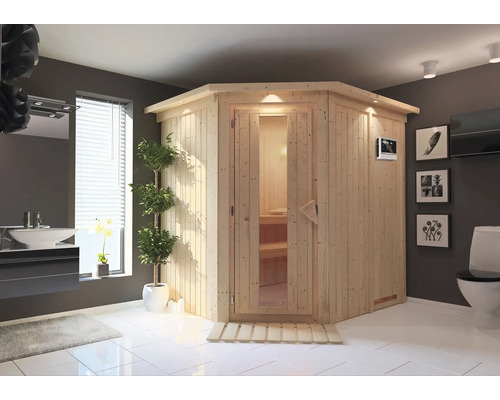 Sauna en bois clair avec porte en verre dans une salle de bain