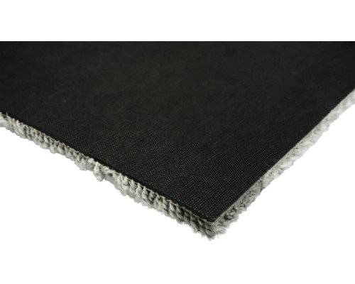 Detailansicht eines Teppichs mit textilem Rücken und Fransen