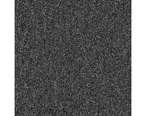 Gros plan d'un tapis sombre à la texture chinée.