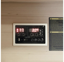 Bedienfeld einer Sauna mit Digitalanzeige und Sicherheitsinformationen
