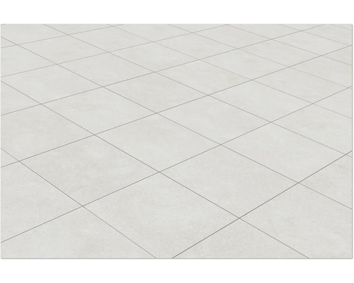 Sol carrelé avec des carreaux clairs carrés et des joints