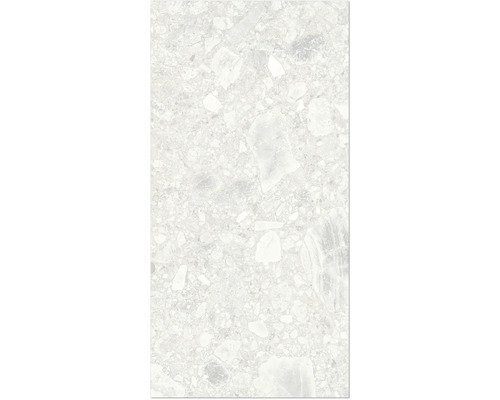 Gros plan d'un carreau de sol avec aspect terrazzo.