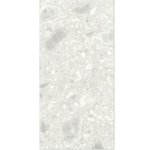 Gros plan d'un carreau de sol à l'aspect terrazzo