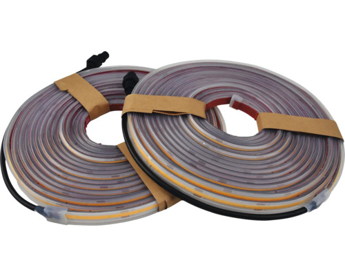 Deux rouleaux de bandes LED avec câble de connexion.