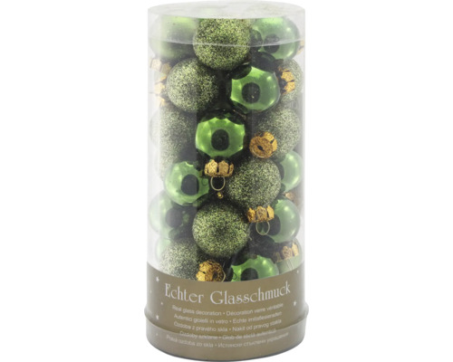 Véritable décoration en verre dans les tons verts dans un emballage transparent.