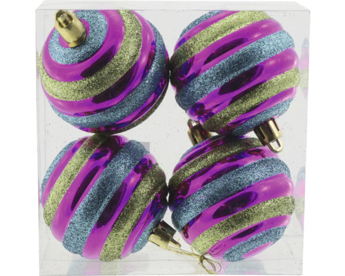 Quatre boules de Noël à rayures dans un récipient transparent