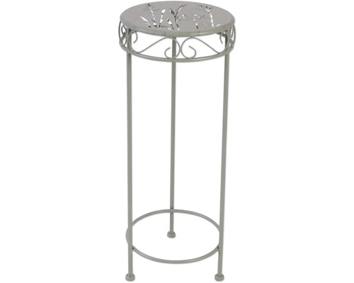 Pflanzensäule aus Metall mit Muster auf der Tischplatte
