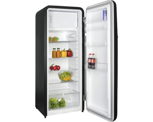 Réfrigérateur ouvert avec des aliments sur des étagères en verre