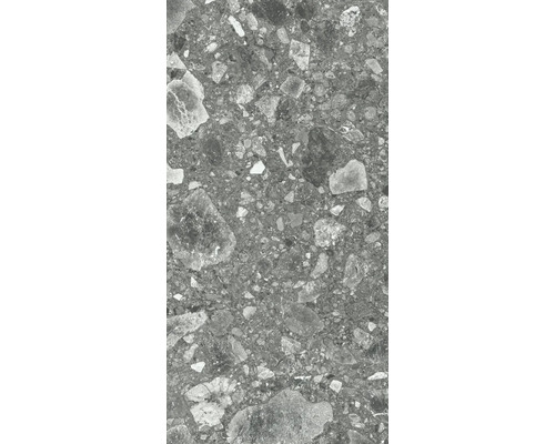 Gros plan d'un carreau de grès cérame gris avec décor en pierre