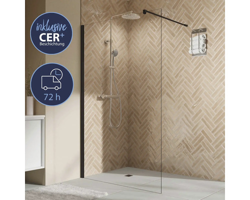 Paroi de douche avec porte-serviettes et robinetterie de douche