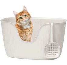 Katze in Katzentoilette mit Streuschaufel