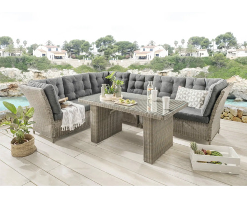 Ensemble lounge Destiny PALMA DE LUXE avec table 140x80x67cm, vintage gris Scène d'un salon de jardin gris avec table et éléments décoratifs à l'extérieur