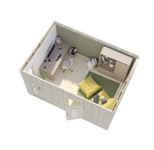 Innenansicht eines Gartenhauses mit Schreibtisch, Stuhl, Aufbewahrungsmöbeln und Sitzkissen