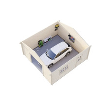 Garage en bois avec une voiture, des étagères et des outils