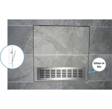 Trappe de visite avec grille en aluminium dans un mur carrelé