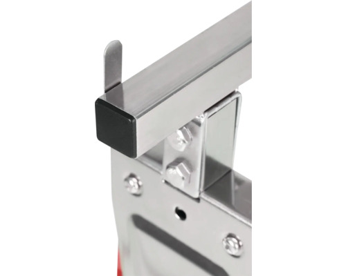 Gros plan d'une agrafeuse métallique avec boulons et capuchon noir