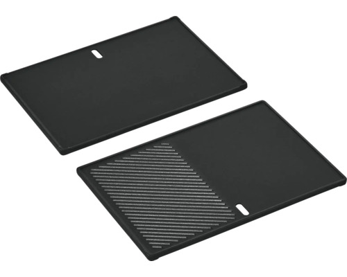 Deux plaques de gril avec une surface lisse et une surface rainurée