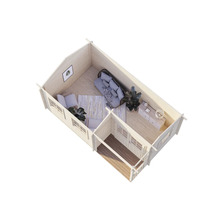 Vue intérieure d'une maison en bois avec des meubles simulant un salon et une chambre.