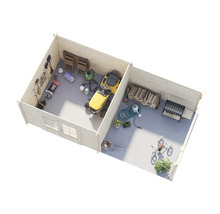 Vue intérieure d'une cabane de jardin avec outils de jardinage, tondeuse à gazon, barbecue et bois