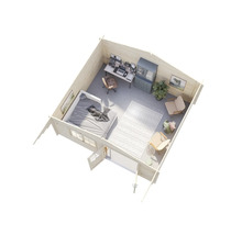 Vue intérieure d'une cabane en rondins avec coin chambre, espace de travail et coin salon.