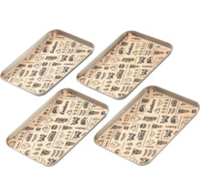 Quatre barquettes de grill avec du papier cuisson pour grillades