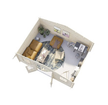 Vue intérieure d'une maison en bois avec canapé, table, tapis et espace de travail.