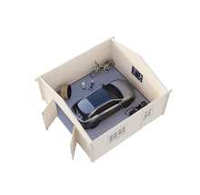 Vue d'un abri de jardin avec voiture, vélo et outils