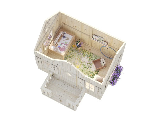 Intérieur d'une cabane de jeu en bois avec table de bricolage, jouets et jardinière