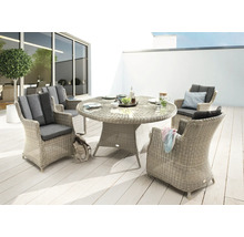 Ensemble de table de jardin ronde en rotin avec quatre fauteuils sur une terrasse