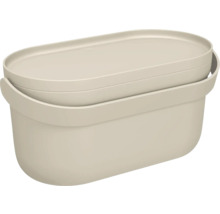 Boîte de rangement ovale en plastique avec couvercle de couleur beige.