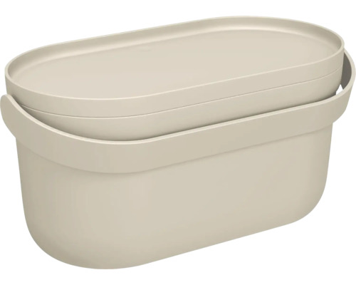 Boîte de rangement ovale en plastique avec couvercle de couleur beige.