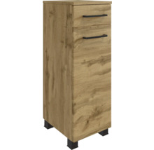 Armoire latérale de salle de bains aspect chêne avec un tiroir, une porte, des poignées noires et des pieds noirs.