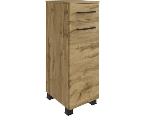 Armoire latérale de salle de bains aspect chêne avec un tiroir, une porte, des poignées noires et des pieds noirs.