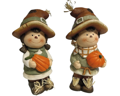 Deux figurines d'épouvantail avec des citrouilles pour la décoration d'automne