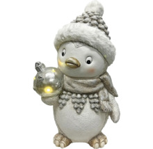 Pingouin décoratif avec bonnet, écharpe et boule de Noël lumineuse.