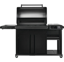 Barbecue à gaz noir avec couvercle ouvert, tables d'appoint et meuble bas