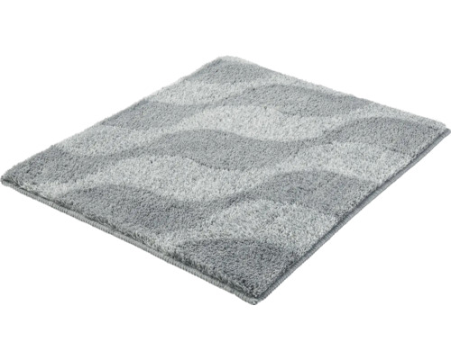 Grauer Badteppich mit Wellenmuster aus weicher Kunstfaser.