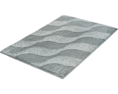 Rechteckige Badematte mit wellenförmigem Muster und weichem Flor in verschiedenen Grautönen.