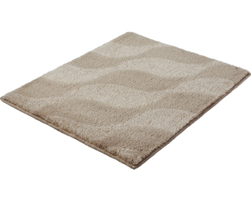 Tapis de bain rectangulaire beige avec poils doux et motif de vagues texturé.