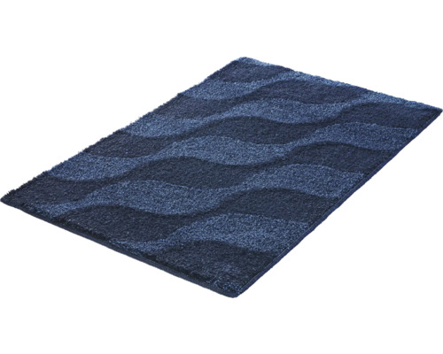 Blaue Badematte mit Wellenmuster und weicher Oberfläche.