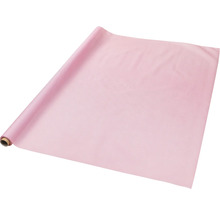 Chemin de table rose en papier sur un rouleau.