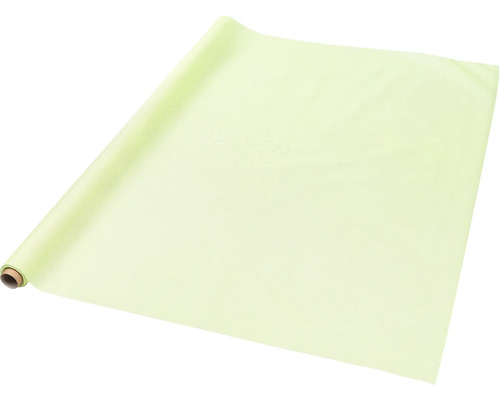 Chemin de table vert clair sur un rouleau en carton.